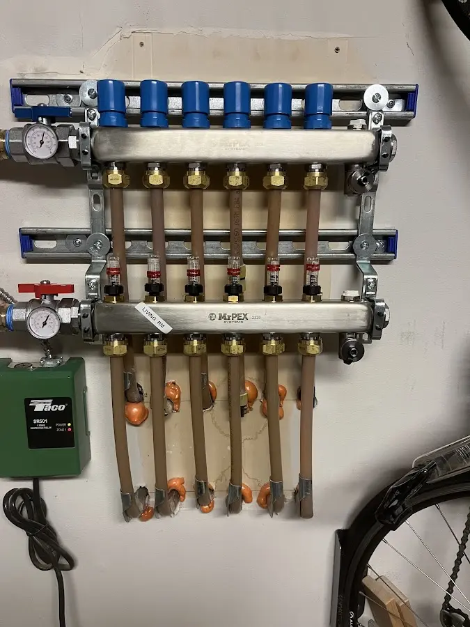 Plumber performing Water Heater Repair at a residential property in Cranston